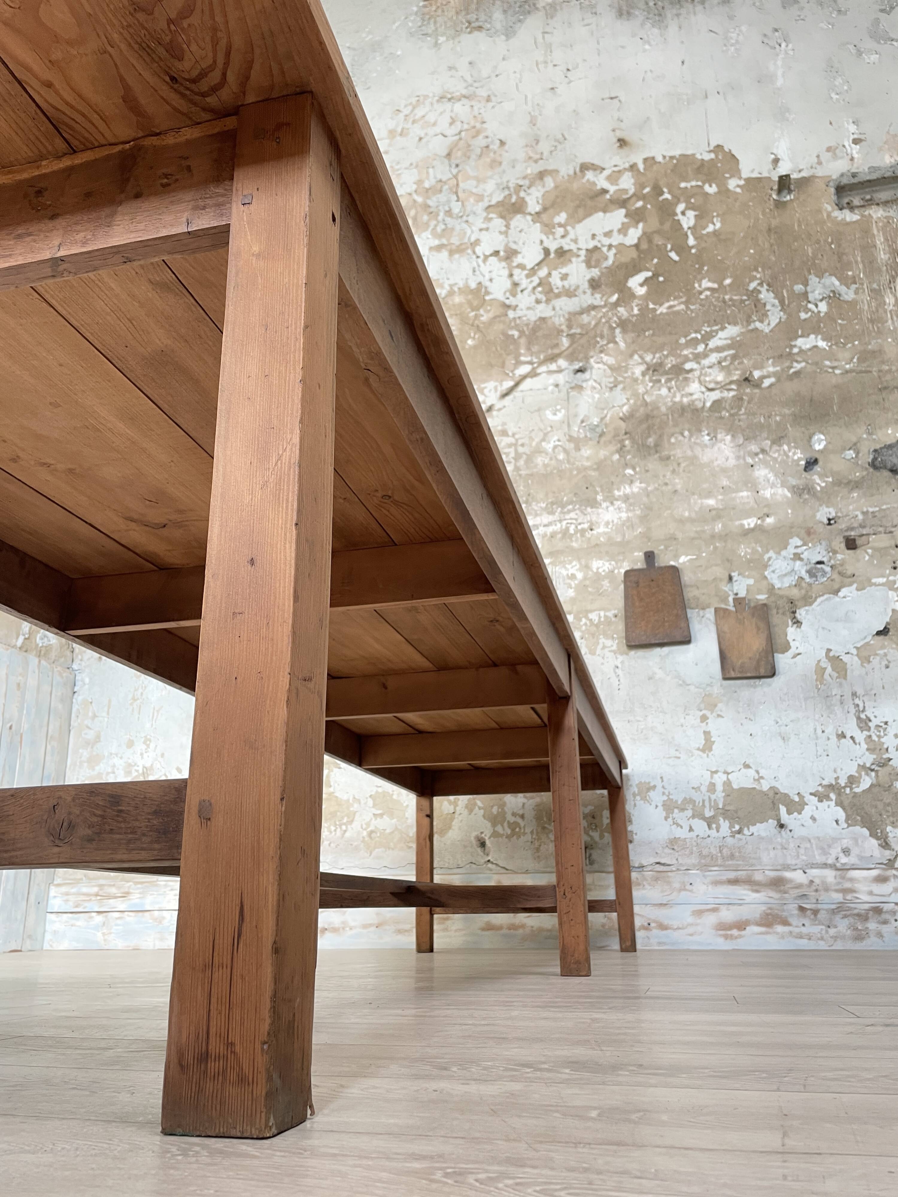 Solid wood workshop table with straight legs.