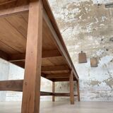 Solid wood workshop table with straight legs.