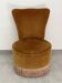 Ochre and fringed pouffe-style armchair