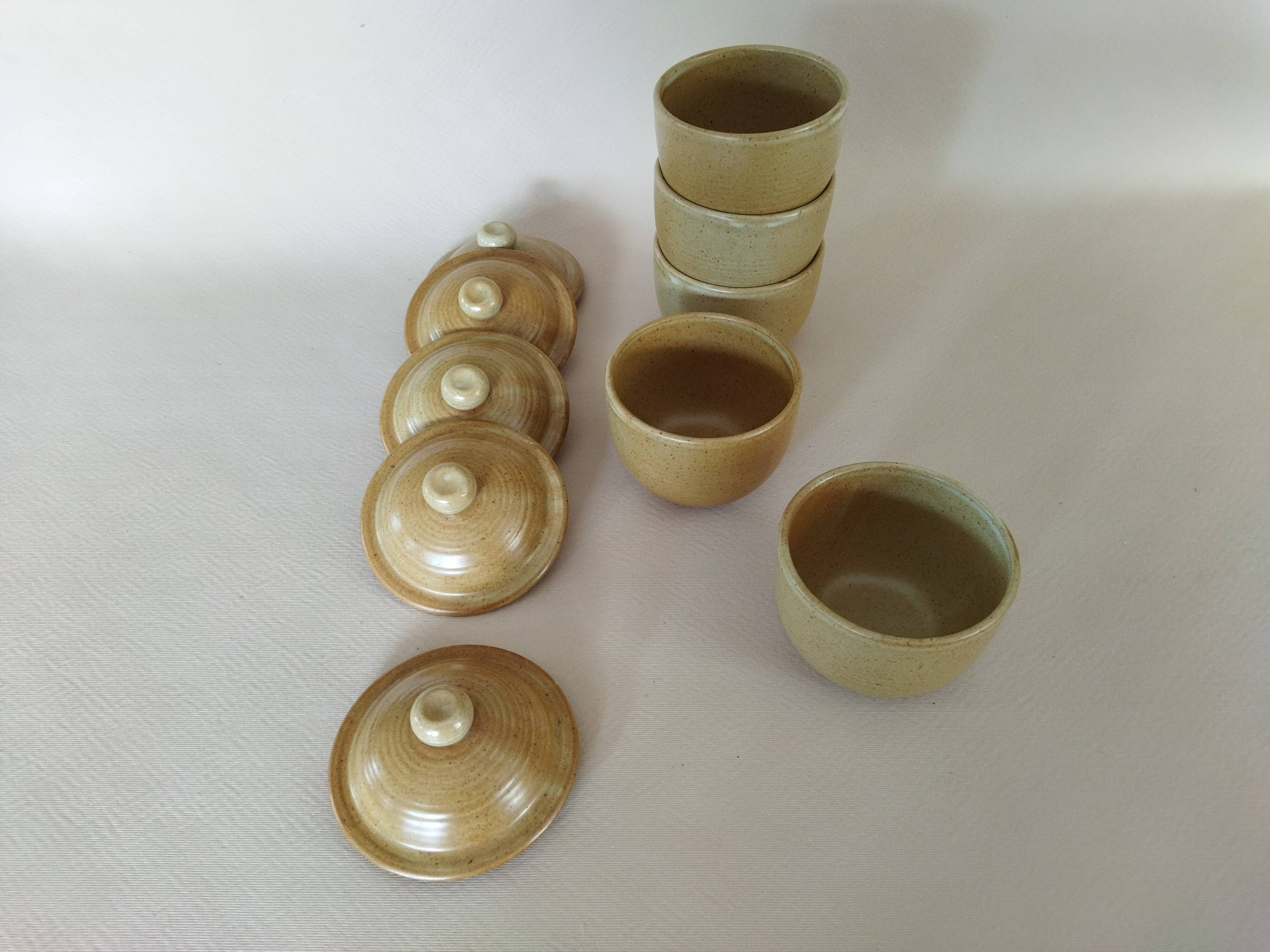 Covered tea bowls in CNP Village sandstone