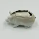 Vintage mustard pot in porcelain shaped like a pig.