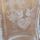 Pair of old engraved and frosted glass bottle vases.