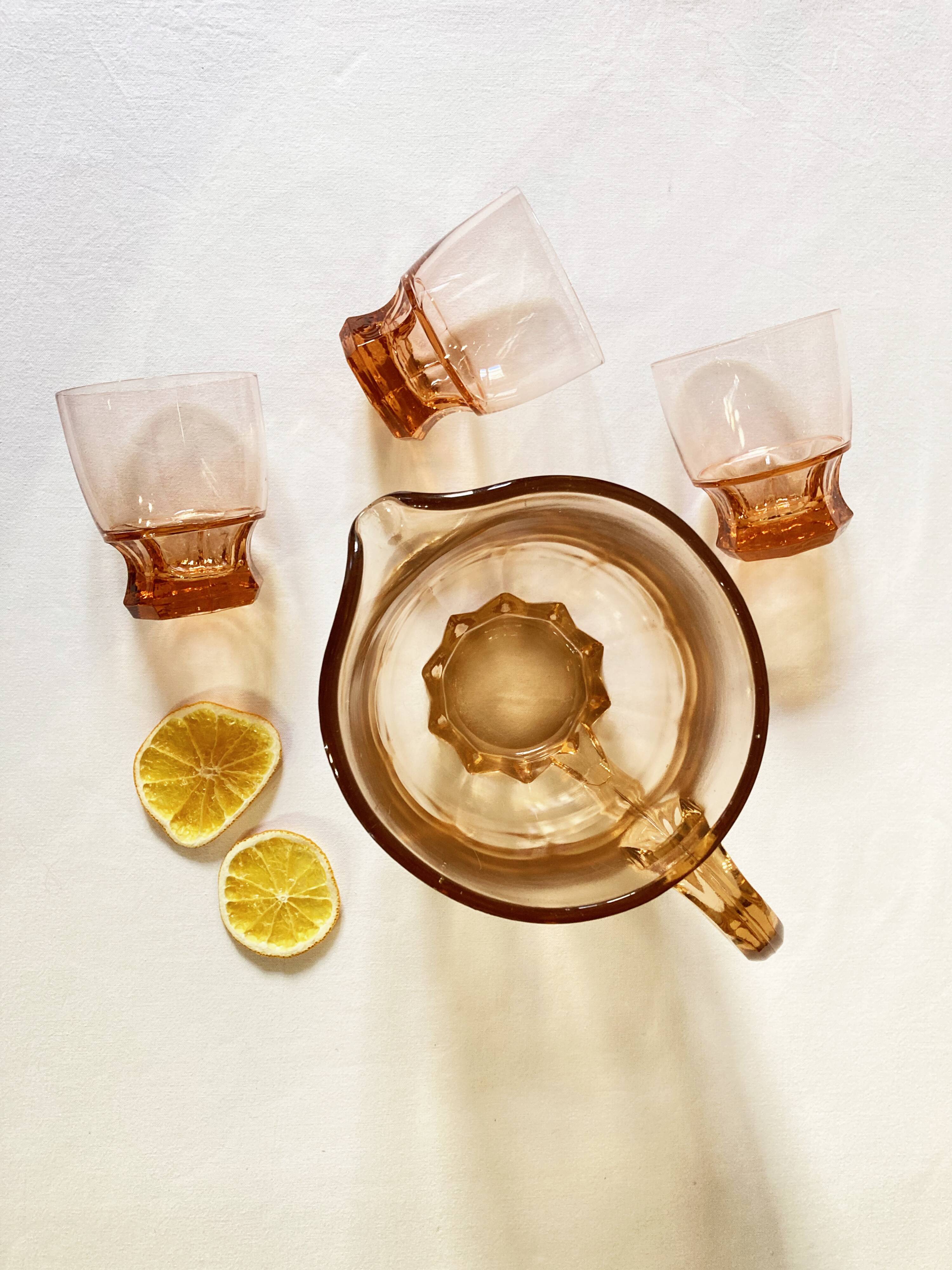 Pitcher and 6 water glasses in pink glass