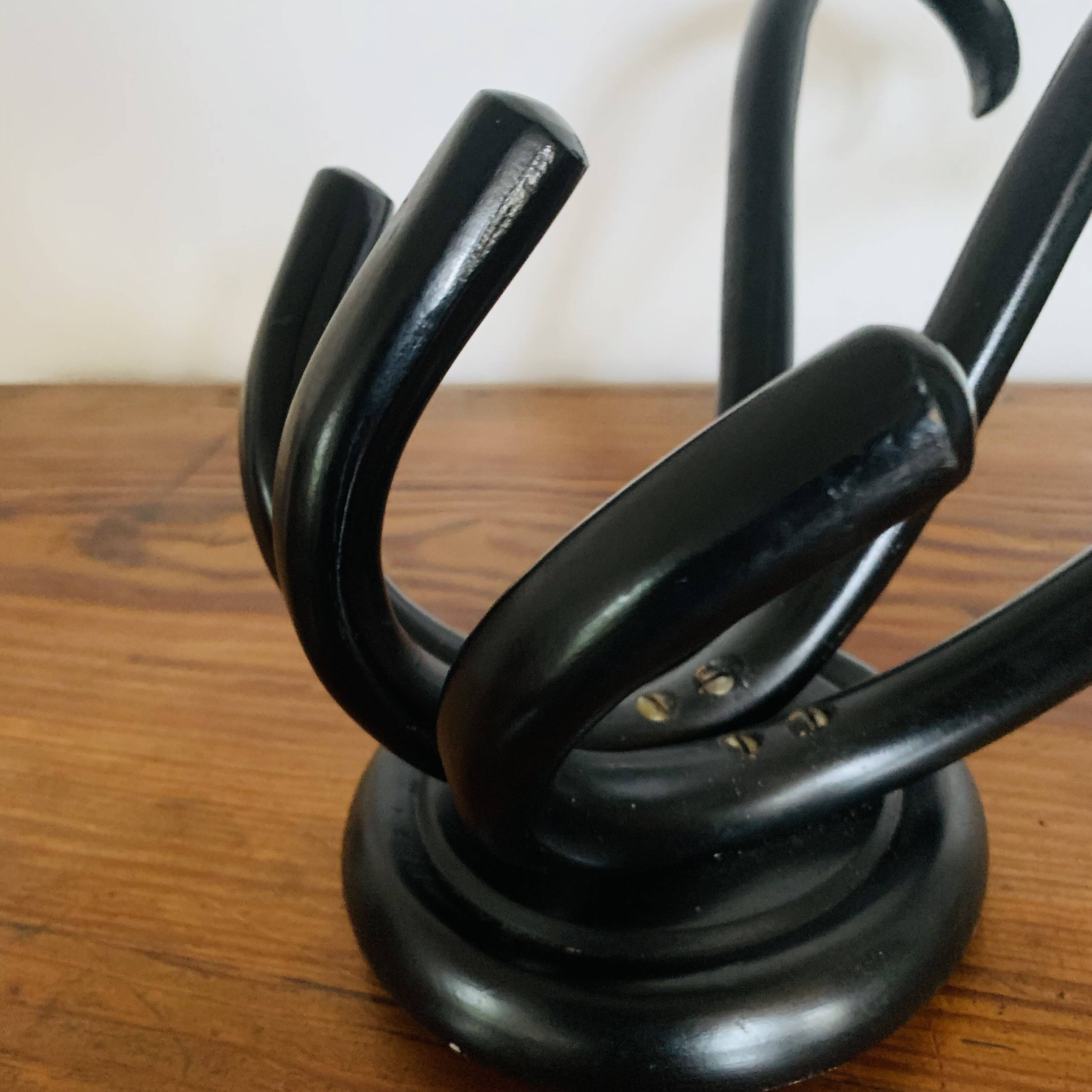 Wall-mounted coat rack with 3 hooks