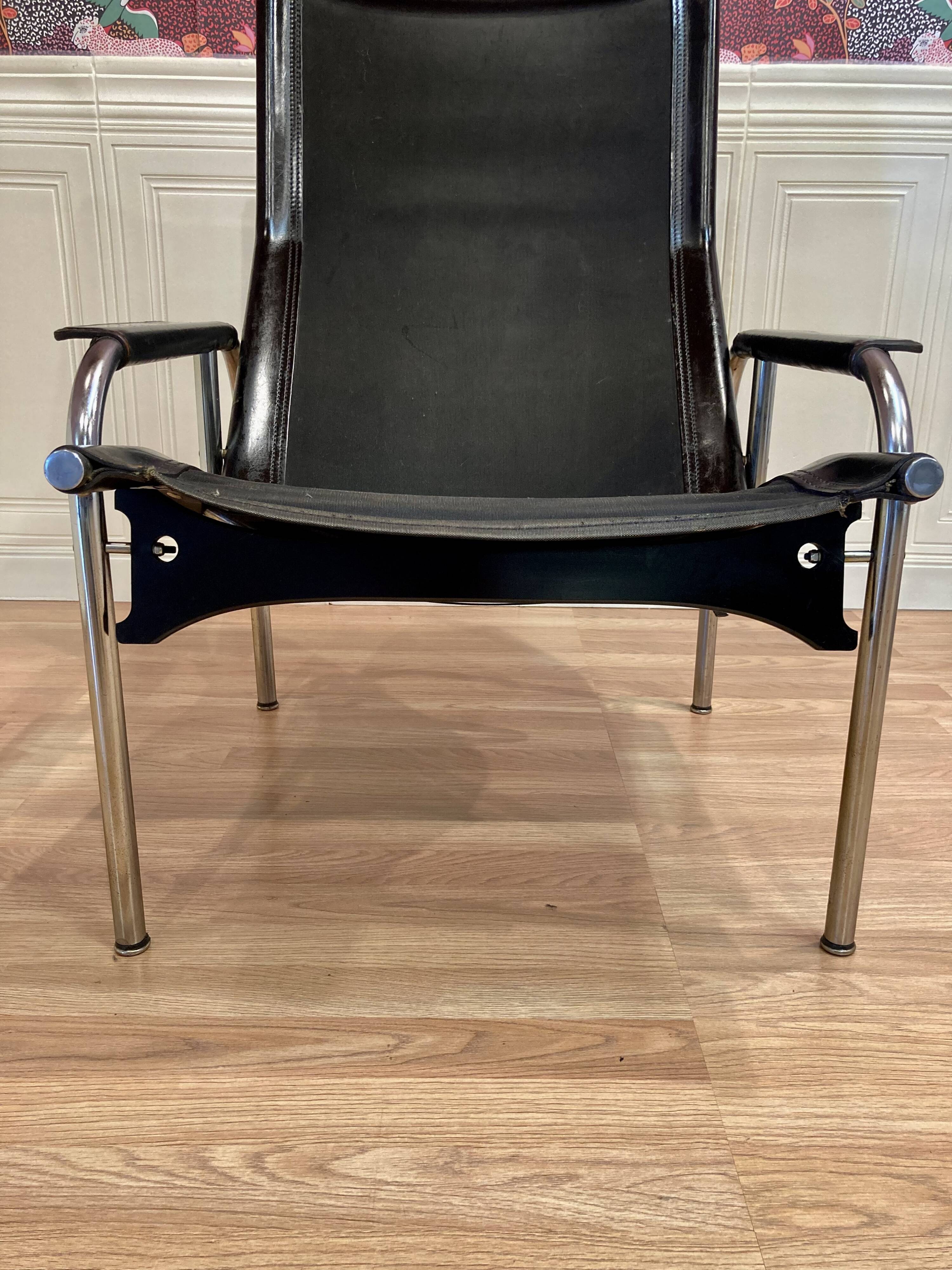 Black leather reclining lounge chair, "Hans Eichenberger" design, 1960.