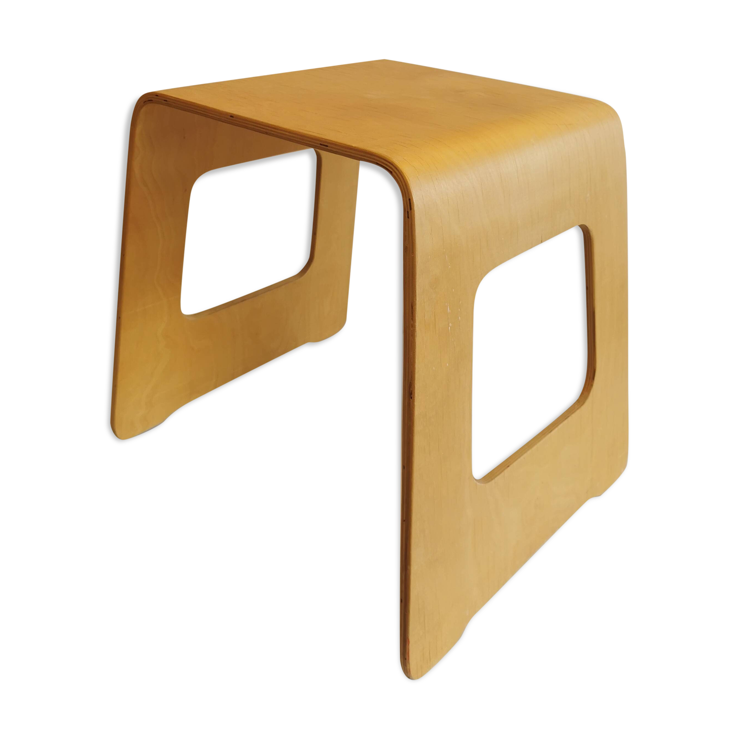 Design stool/side table made of curved plywood.
