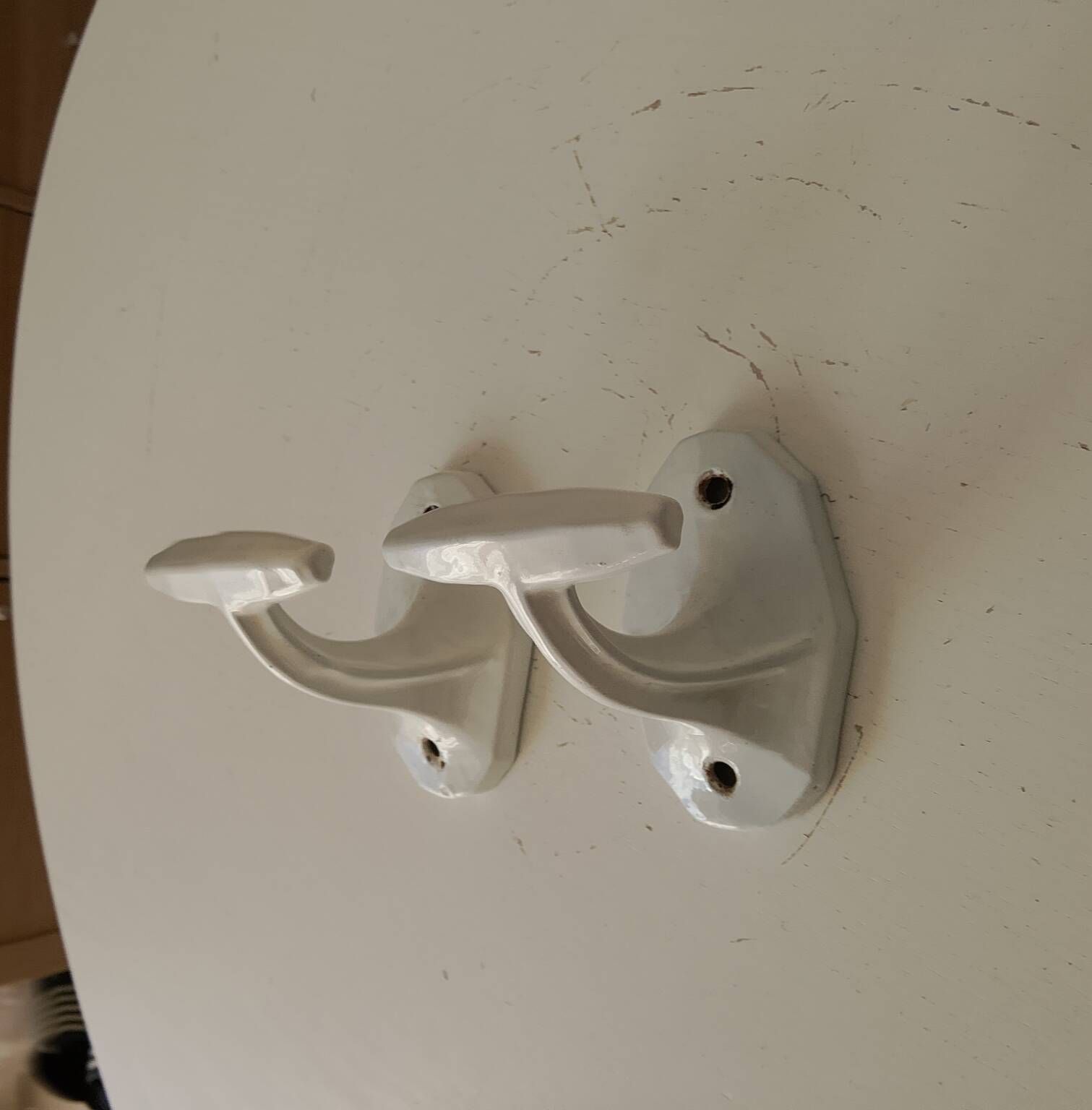Antique Art Deco wall coat hook in enamelled cast iron.