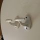 Antique Art Deco wall coat hook in enamelled cast iron.