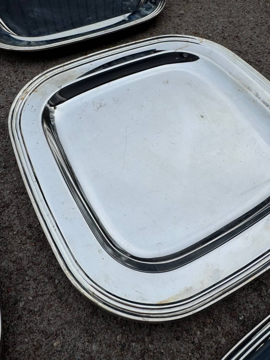 Silver-plated metal underplates from the 1980s.