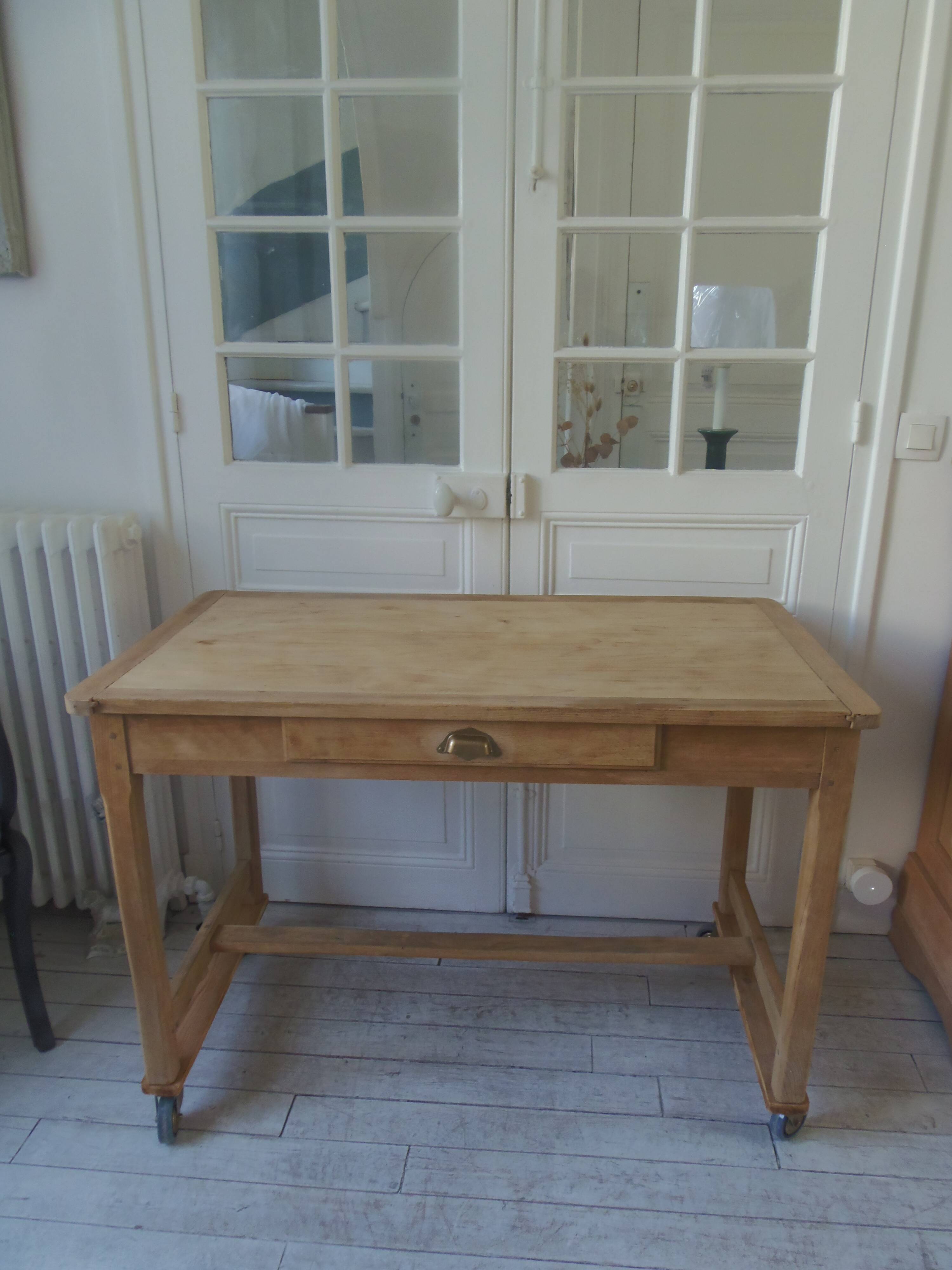 Vintage kitchen table on casters.