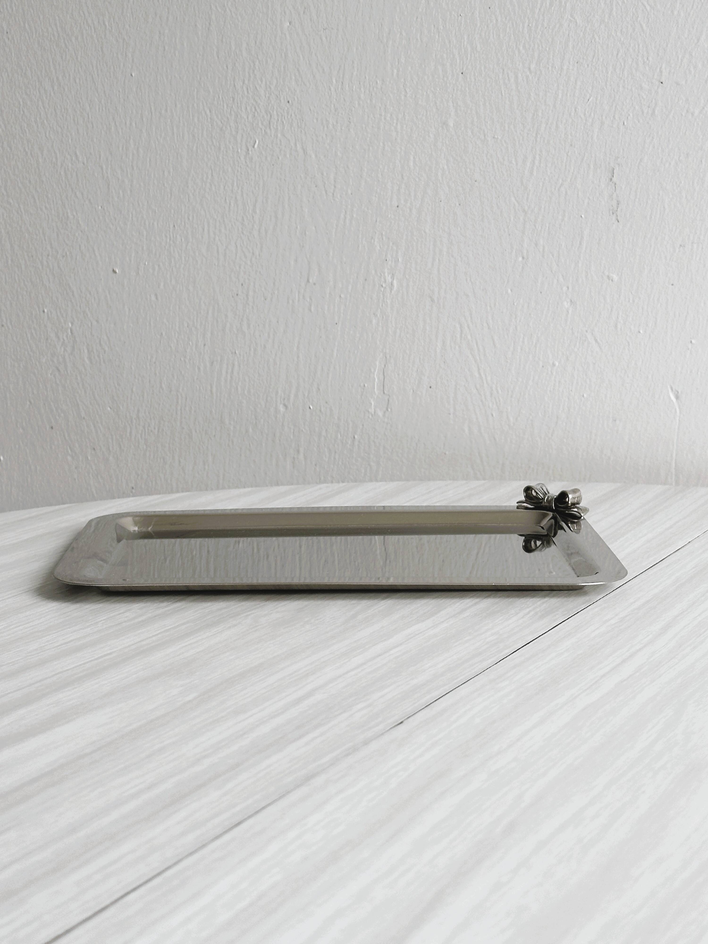Small vintage metal tray with decorative knot