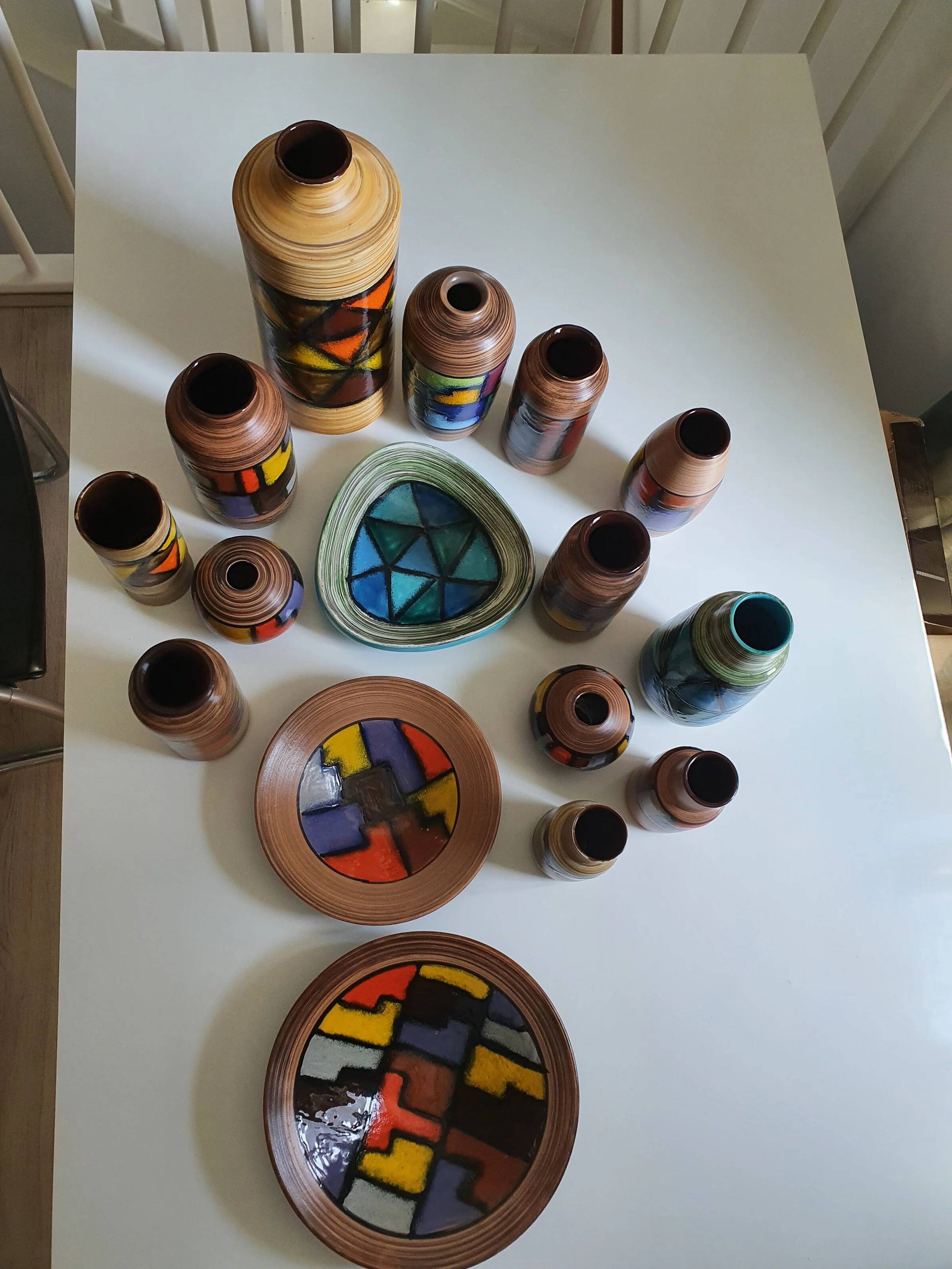 Mid-century pattern Vetrata vases and bowls by Aldo Londi for Bitossi Italy. Black, blue, orange and yellow on a brushed background.