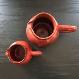 Pair of red pitchers