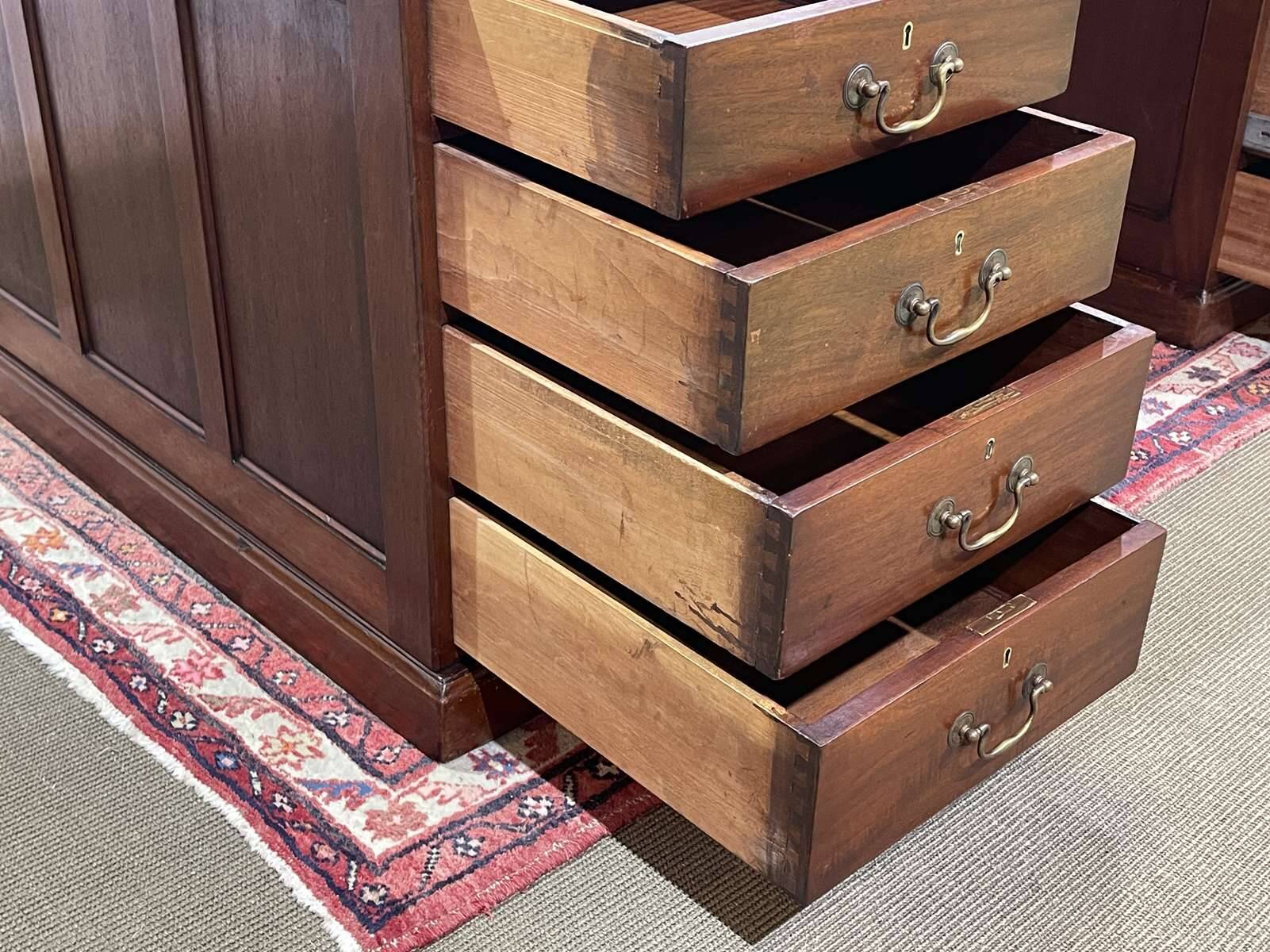 Large English flat desk in mahogany with leather top, early 20th century