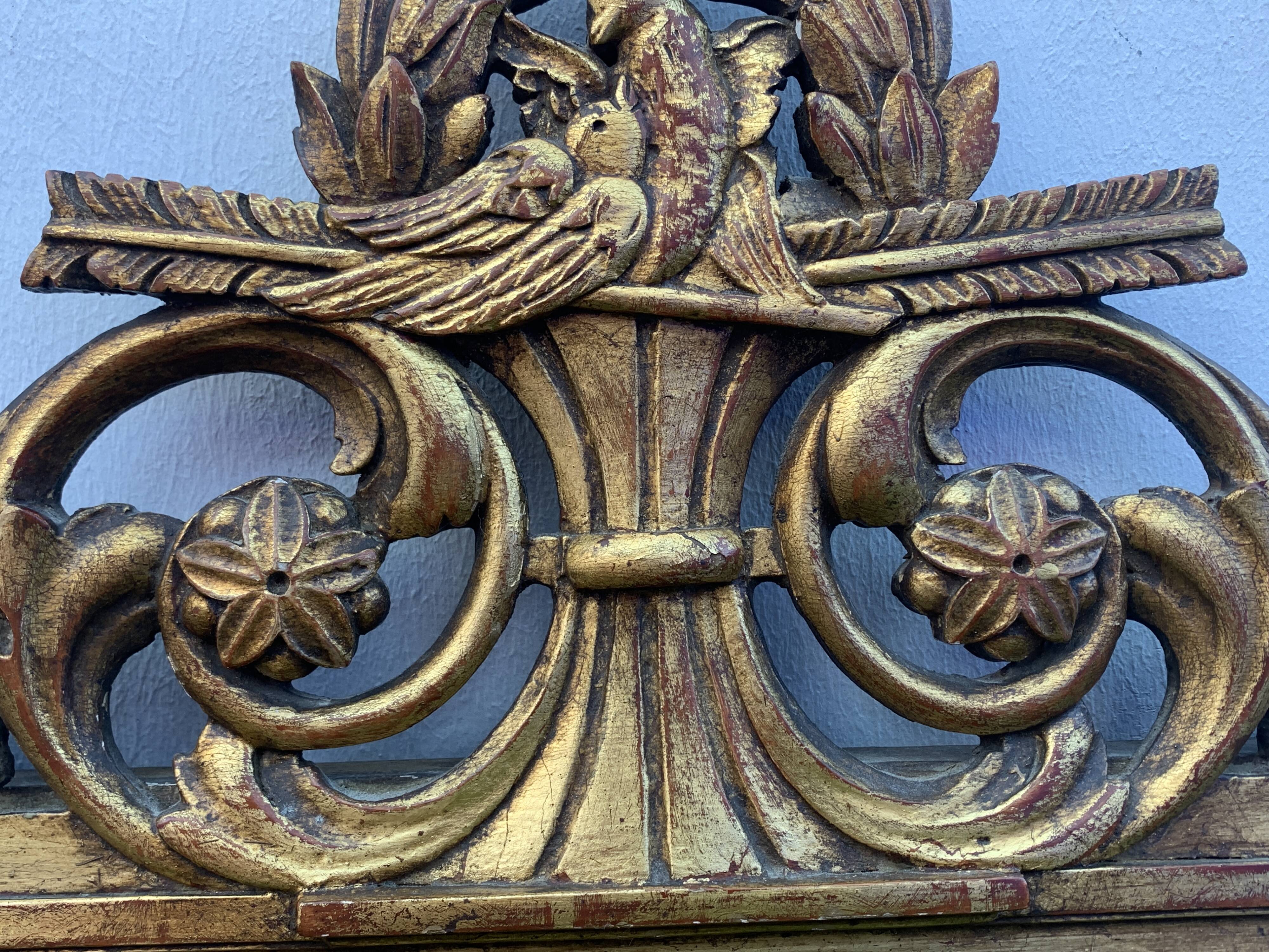 Antique mirror with gilded wood pediment, Louis XVI style