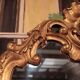 Miroir de style Louis XV en bois doré XXème