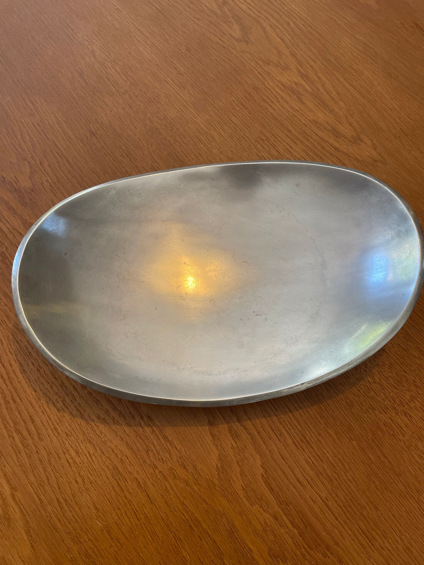 Elegant forged aluminium catchall.