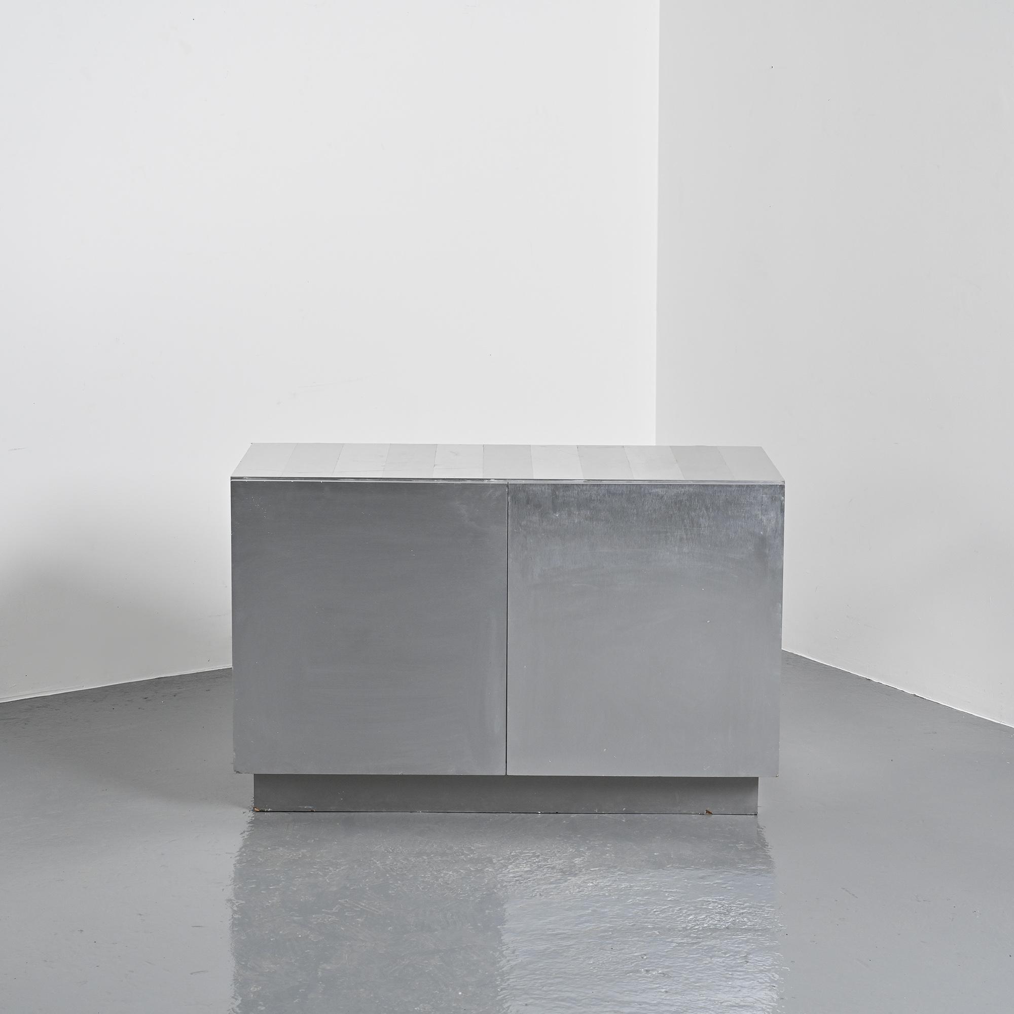 Pair of low buffets in brushed metal, French work, 1970s.