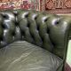 Chesterfield 2-seater green leather sofa from the 1980s