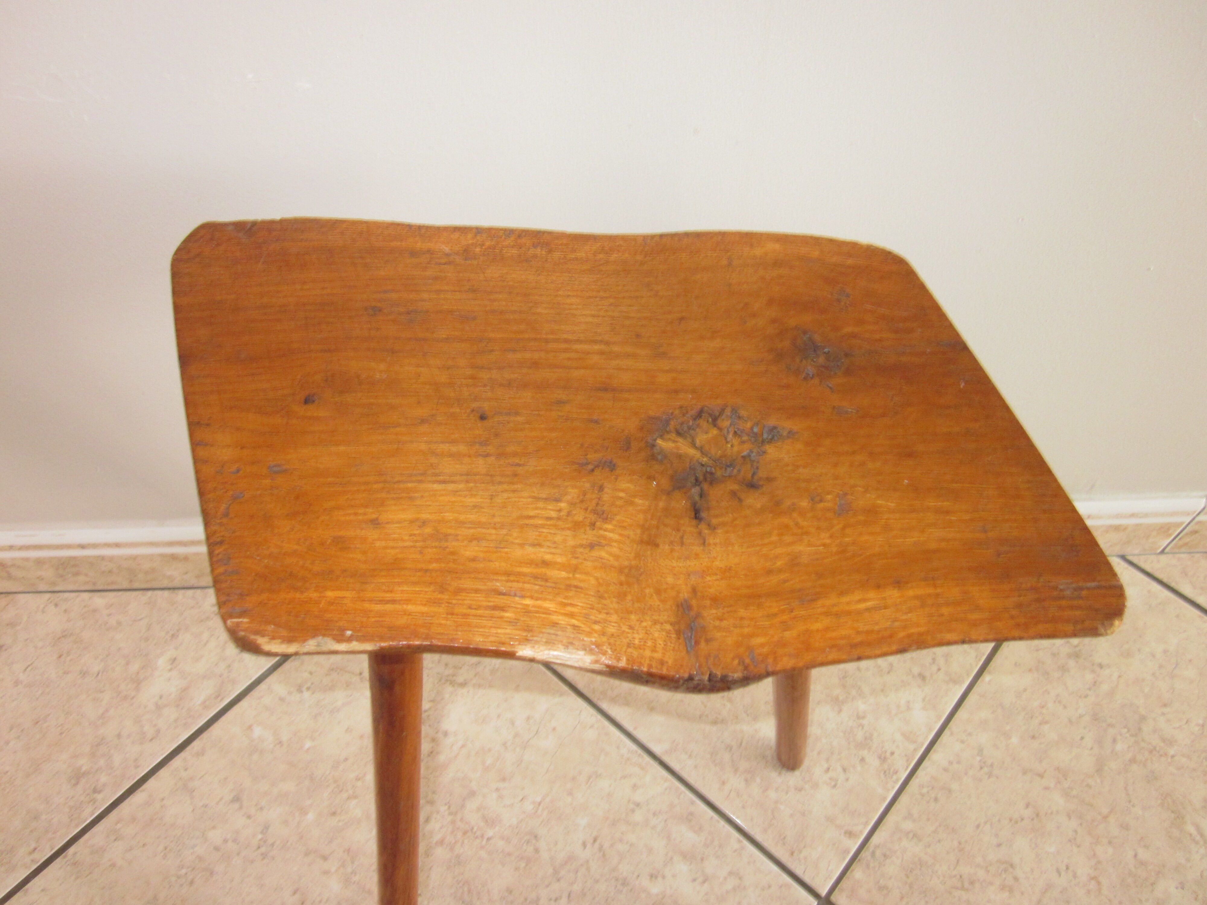 Raw wooden tripod stool