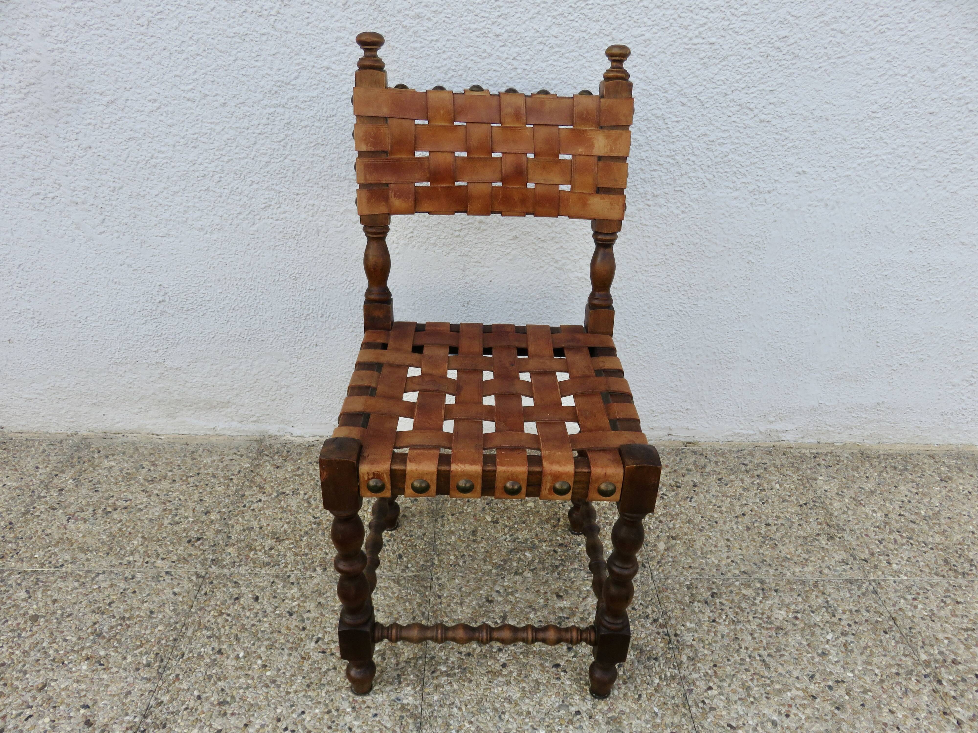 Spanish chair in oak with thick cognac leather straps, 1940s.