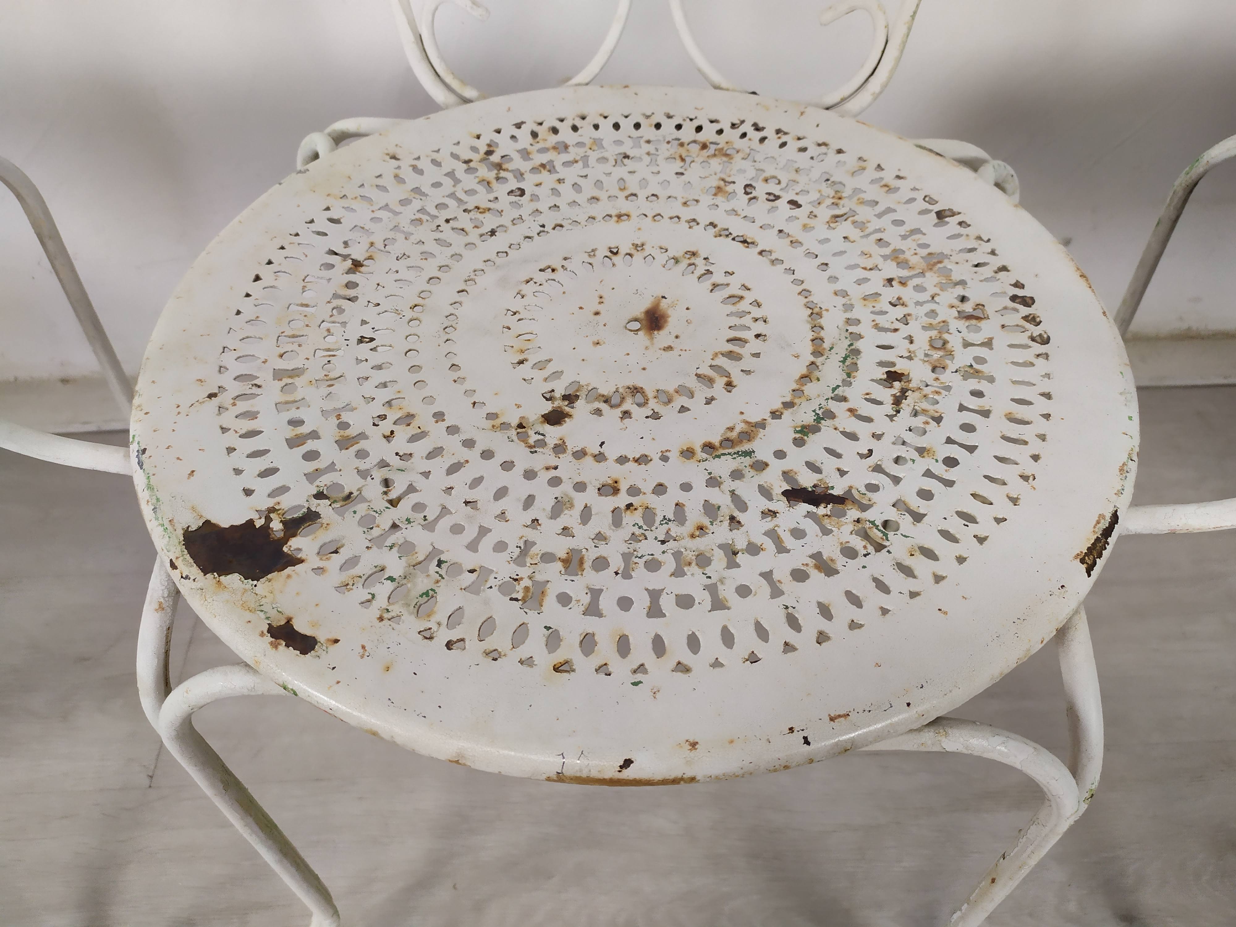 4 wrought iron garden armchairs