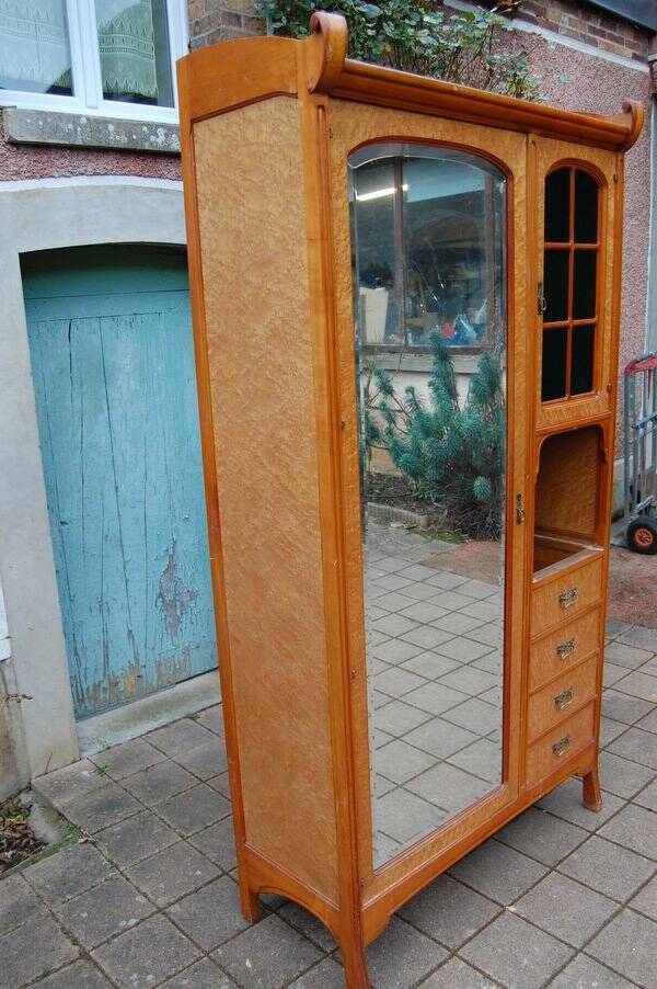 Art Nouveau mirrored wardrobe in mottled maple from the 1930s.
