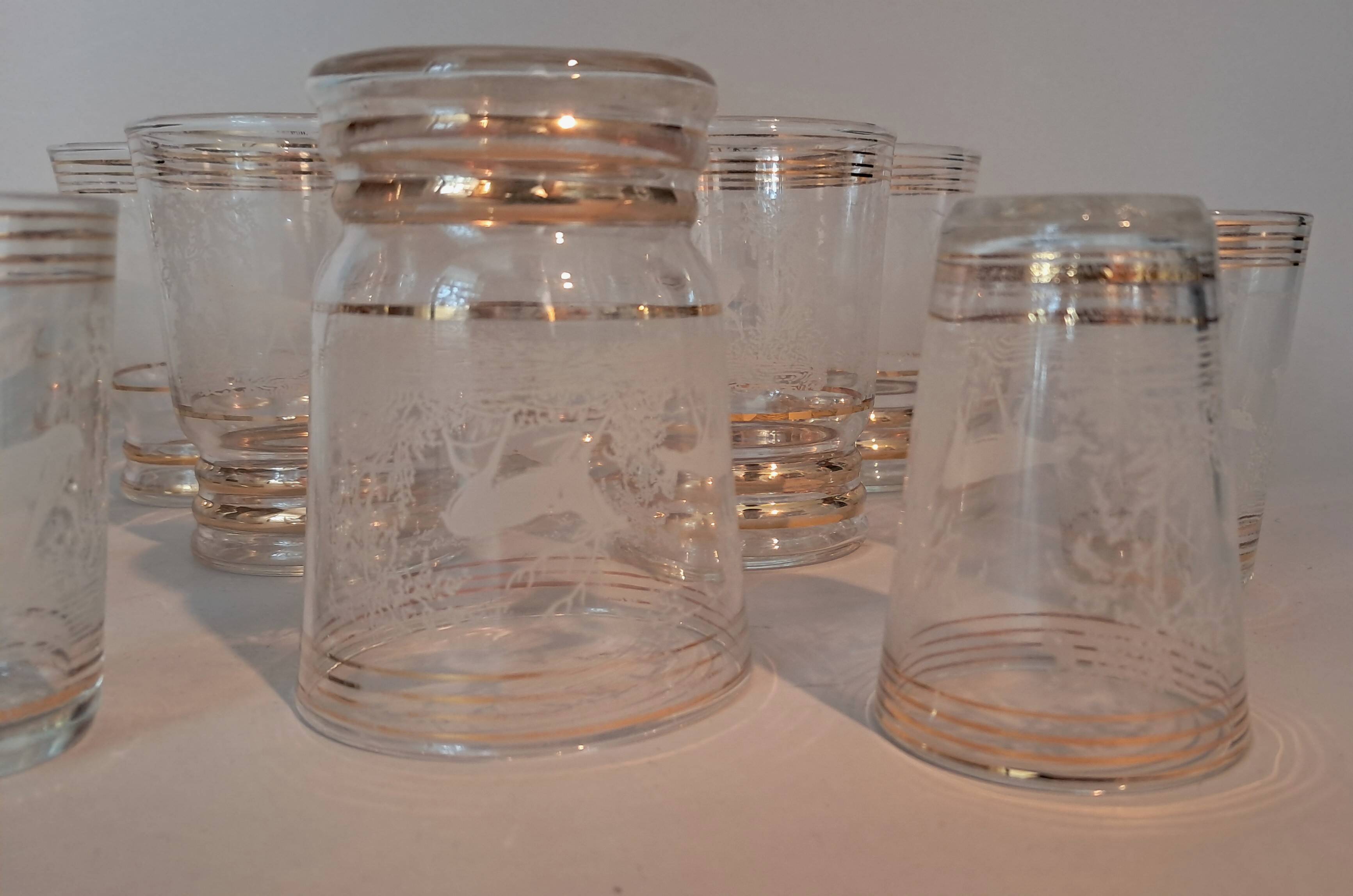 Service of 14 gold-plated and engraved glasses with a deer in the woods design from 1950
