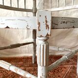 19th-century corner fireplace armchair, wood and cane.