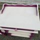 2 vintage bedside tables painted in white and purple with a drawer.