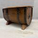 Oak barrel-shaped storage chest with black metal straps, 1930s-1940s.