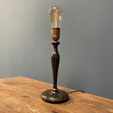 Black table lamp with paint splatters from the 1920s