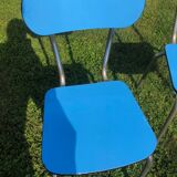 Two blue chairs in formica