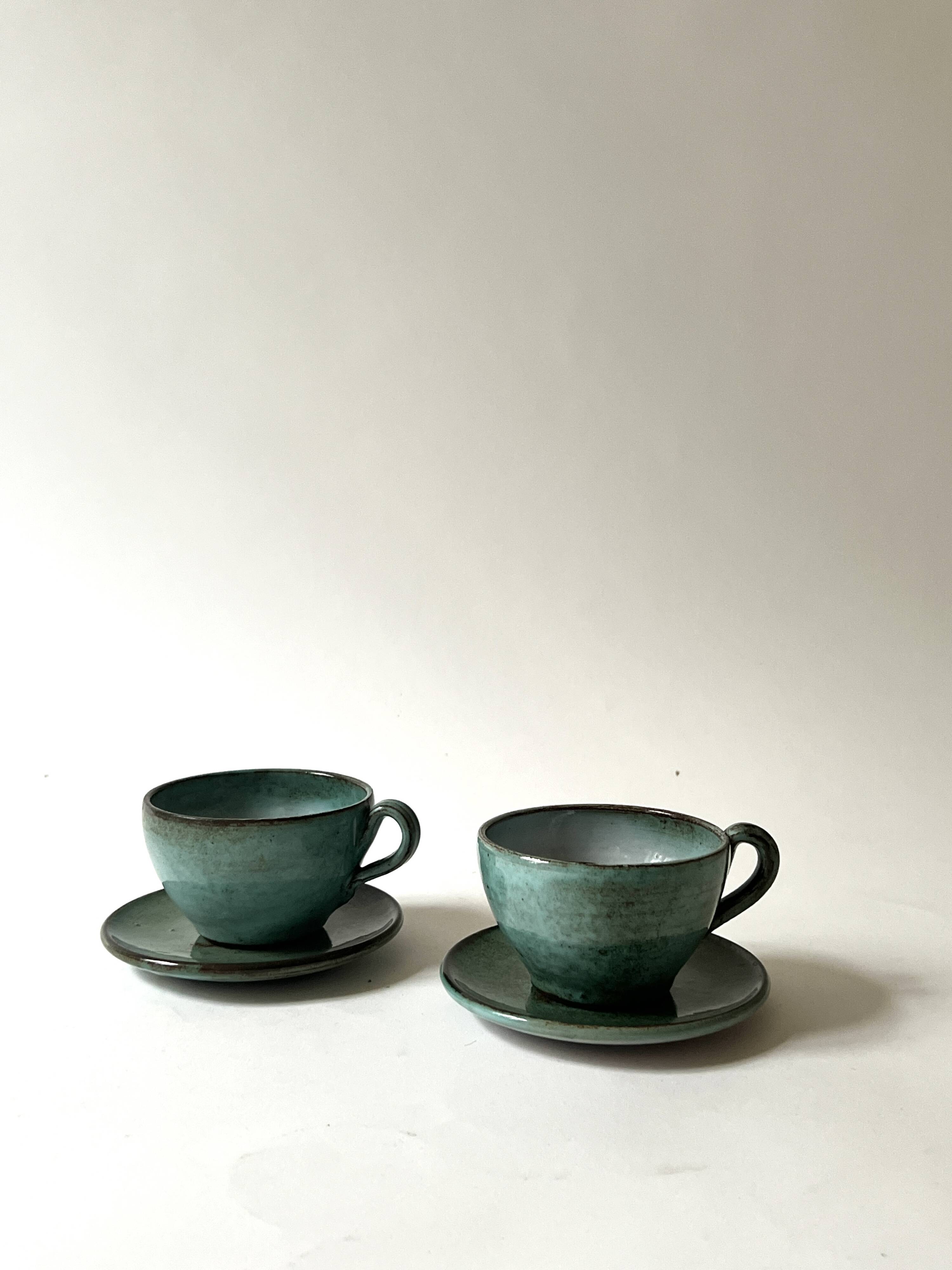 Handmade and signed glazed ceramic coffee cups, circa 1950.