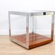 A vintage mid-century glass and rosewood side table by Merrow Associates