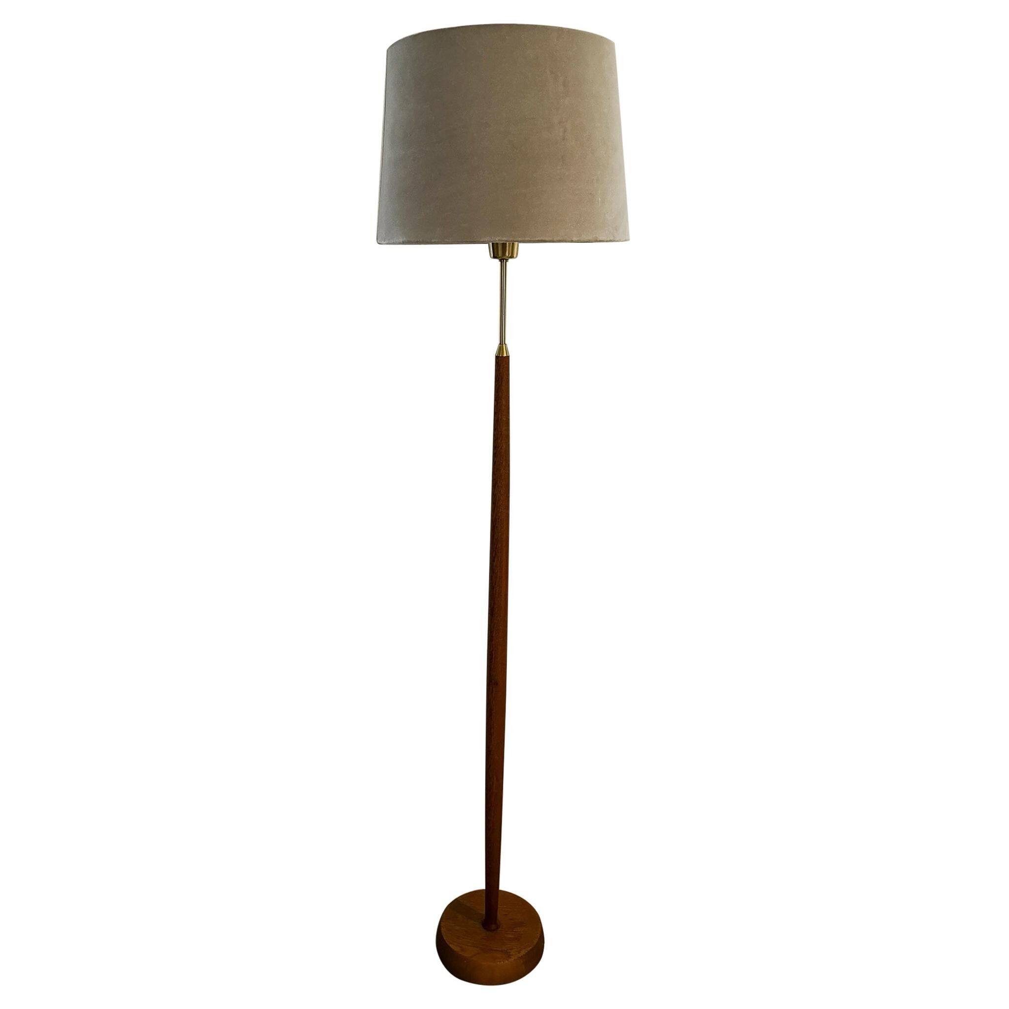 Mid-century floor lamp in teak and brass by Falkenbergs Belysning, Sweden, 1960s.