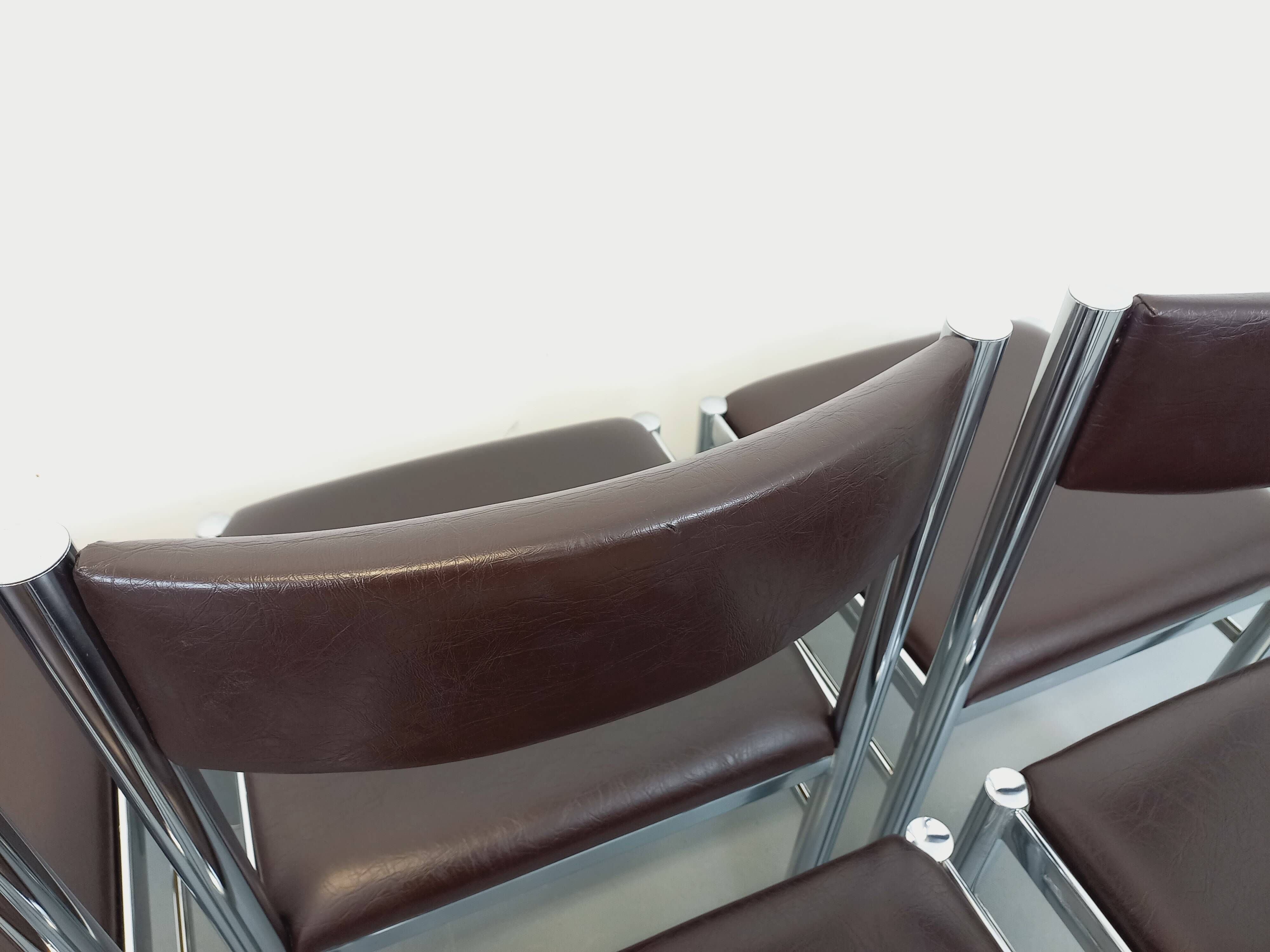 Set of 6 vintage chairs from the 70s in chrome metal and brown faux leather.