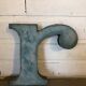 Blue sign letter "R"