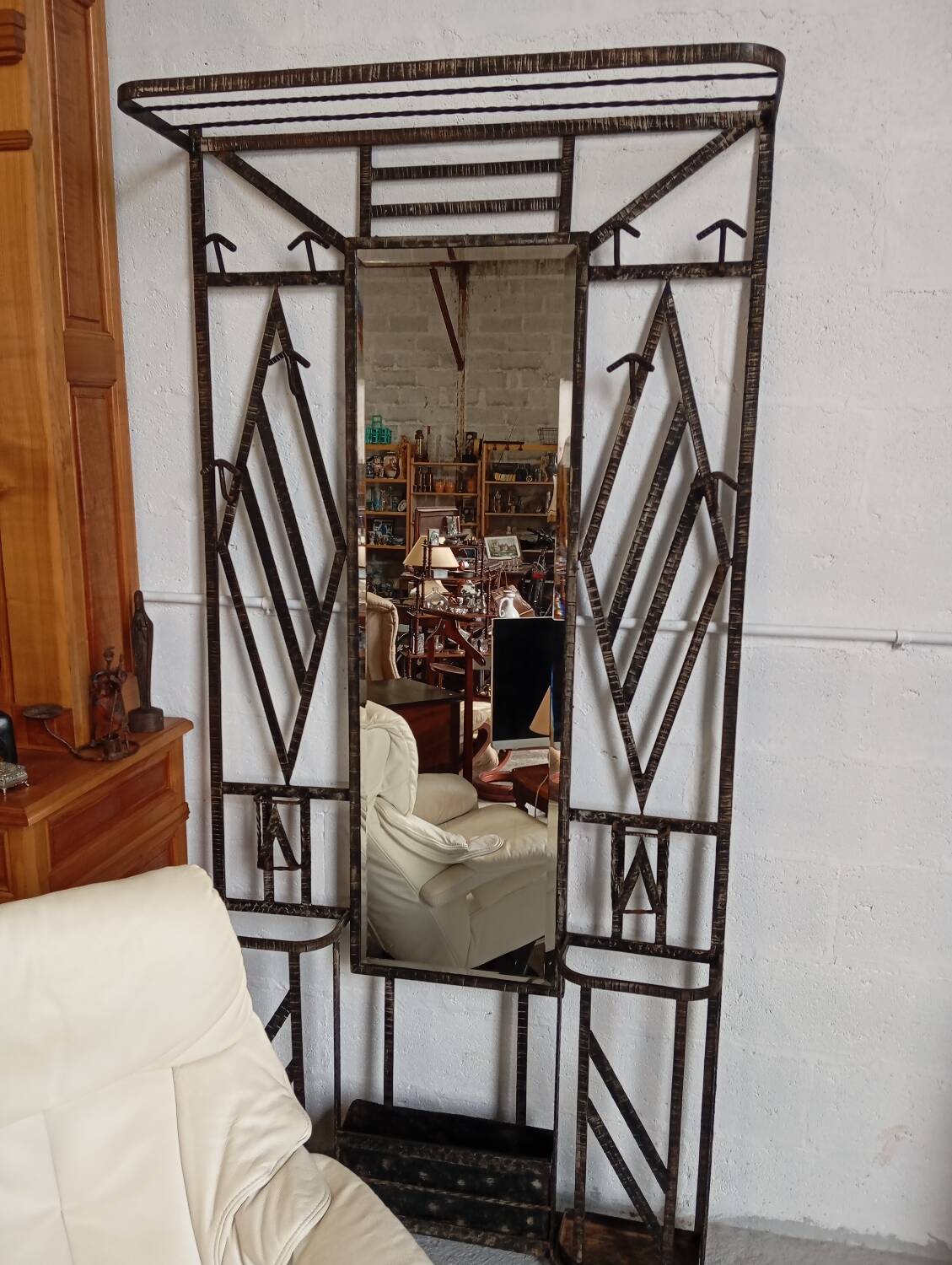 Exceptional and imposing hall wardrobe in hammered wrought iron.