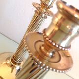 Pair of empire style brass candlesticks