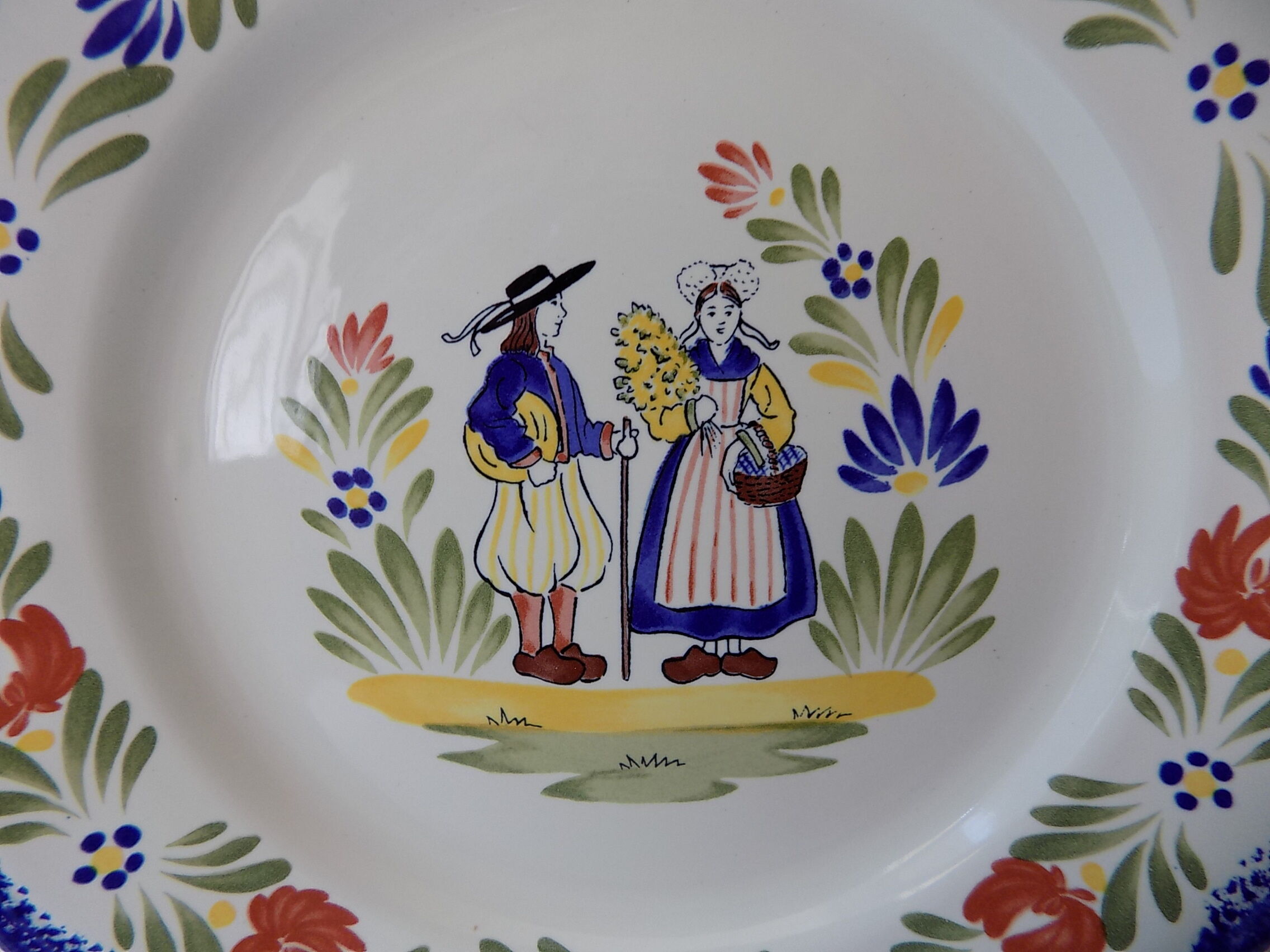 Plate of Breton earthenware of regional art KG France Quimper