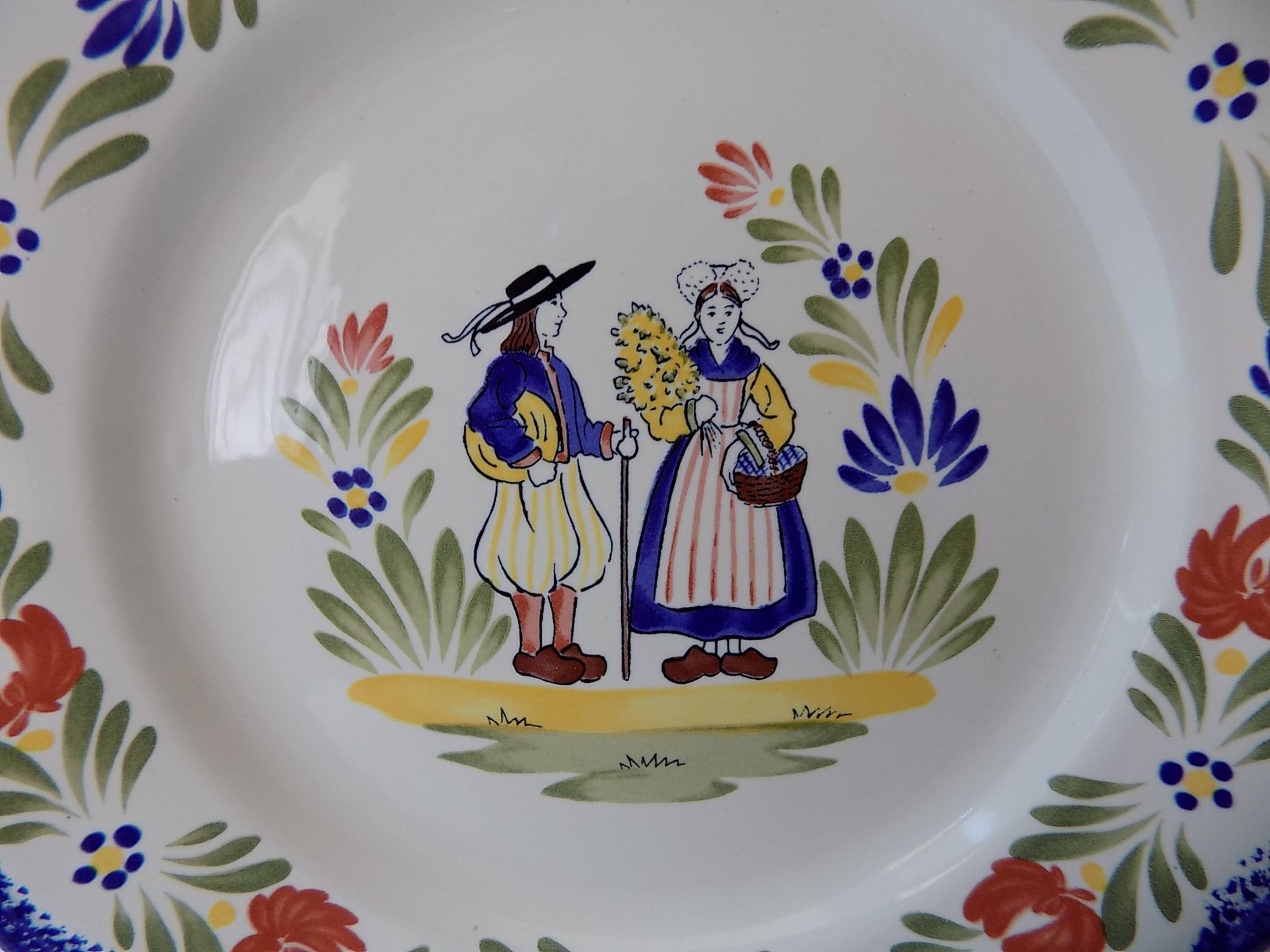 Plate of Breton earthenware of regional art KG France Quimper