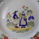 Plate of Breton earthenware of regional art KG France Quimper