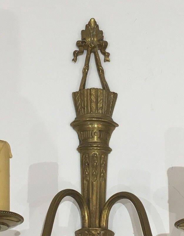 Pair of Louis XVI style bronze wall sconces with quivers and ribbons