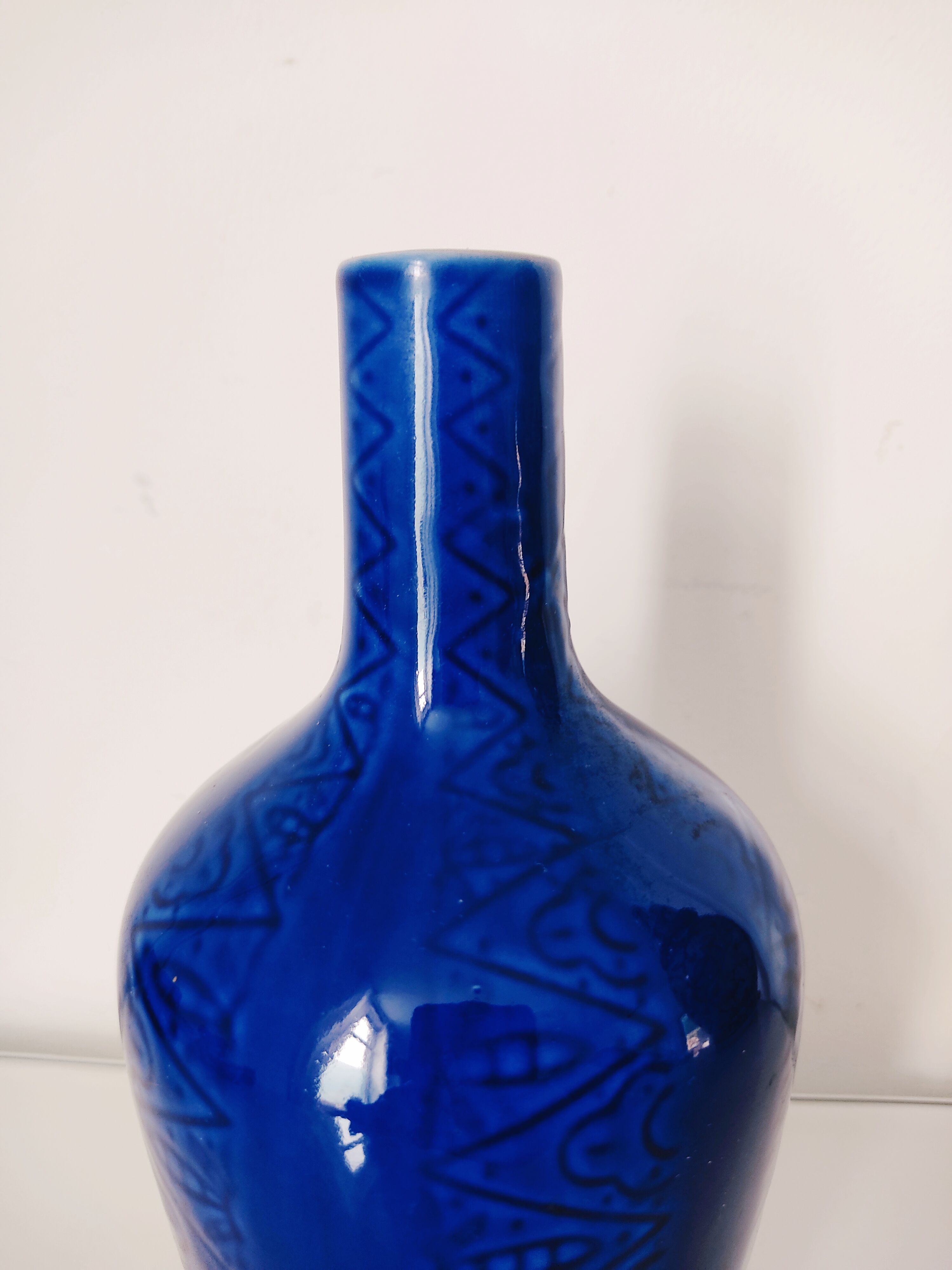 Blue vase geometric incised decoration