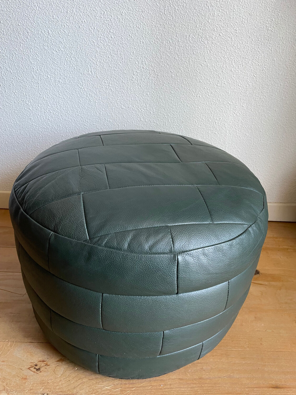 Green patchwork leather pouf from Sède