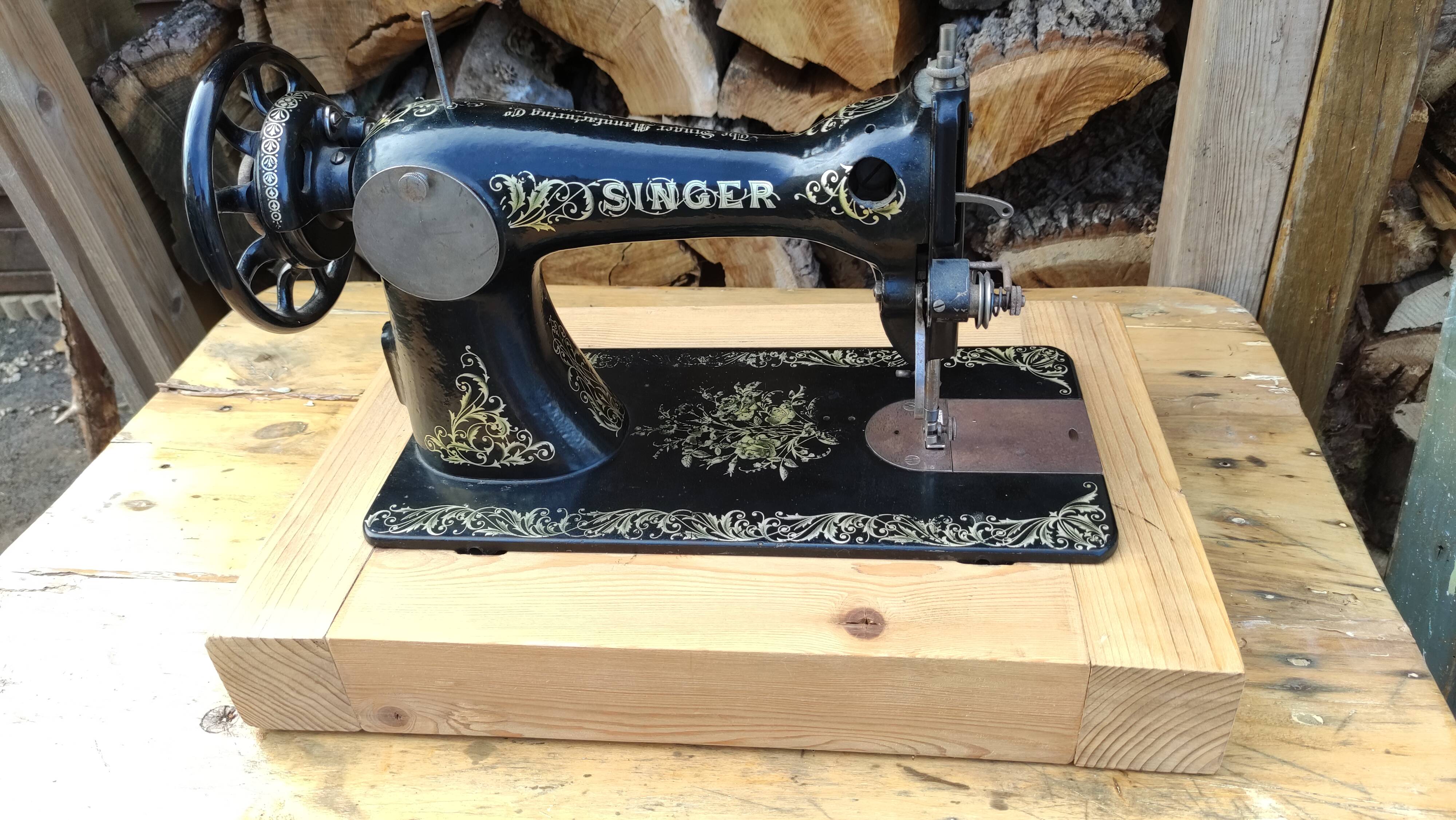 Old Singer sewing machine on pedestal