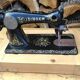 Old Singer sewing machine on pedestal