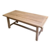 Farm table made of solid light oak wood.