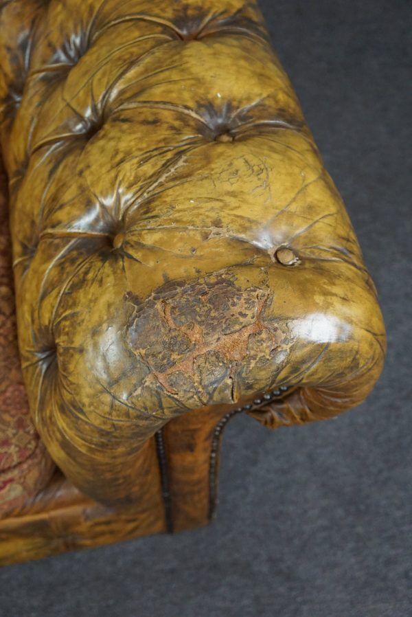 Patinated Chesterfield armchair